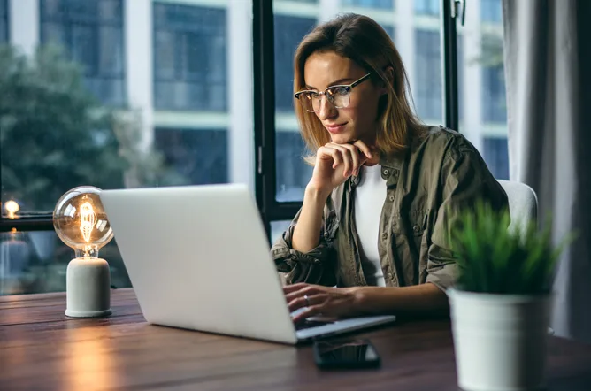 Young woman working with a laptop at the office